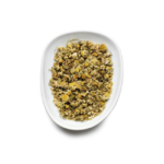 A pristine oval dish, echoing a café's finest presentation, displays a delicate assortment of Birchall Camomile Tea Bags on a white background. The chamomile appears light brown with vibrant yellow flower heads, poised to inspire any barista's creativity.