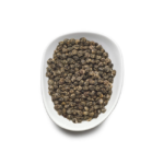 A white oval dish is filled with small, round Birchall Jasmine Green Tea Pearls tea bags, reminiscent of the artisanal touch of a skilled barista in a cozy café.