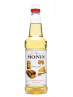 A 1-liter bottle of Monin Honeycomb Syrup, ideal for barista creations in any café, features a clear label with images of honeycomb and caramel candies. It is topped with a white and red cap and beautifully showcases the product's description and branding.