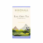 The image showcases a box of Birchall Earl Grey Tea Bags featuring a picturesque design of rolling hills, evoking the ambiance of a cozy café backdrop. It highlights "East Africa's finest tea" and notes "Estate Grown." Containing 25 enveloped tea bags and displaying the Fairtrade logo, it's an ideal choice for any barista's collection.