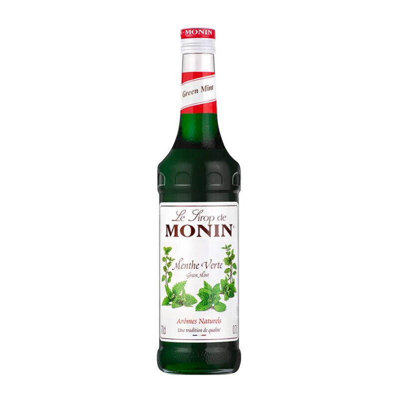 A bottle of Monin Green Mint syrup with a dark green liquid, perfect for any café setting. The label features images of mint leaves and is marked "Menthe Verte" with French text about natural aromas, making it a barista's favorite addition. A red cap tops the bottle.