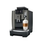 The Jura W8 - Tanked Bean to Cup Coffee Machine, with its contemporary design and digital display complemented by shiny accents, delivers a layered cappuccino into a glass cup, making it feel like you have a personal barista right in your kitchen.